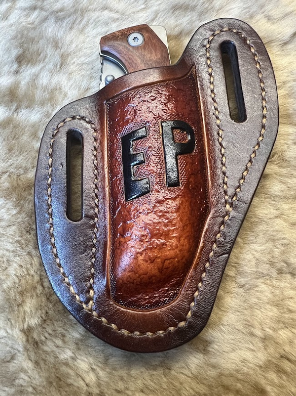 Custom pancake knife sheath with stamped initials EP, rich cognac leather