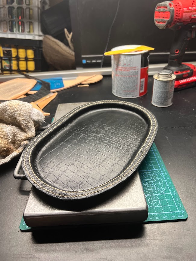 Custom western leather holster with Texas star concho and basketweave tooling
