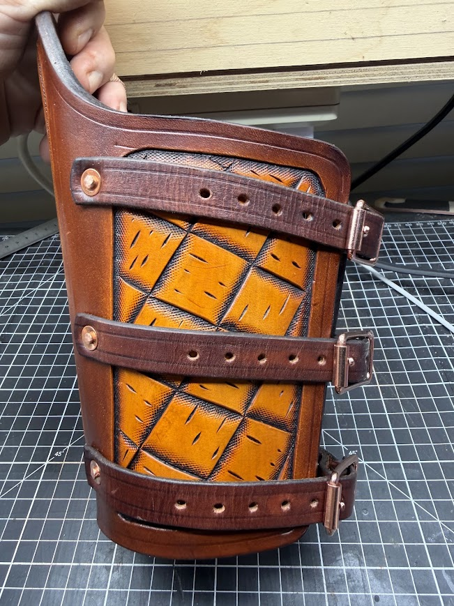 Back view showing diamond basketweave tooling and copper buckle straps